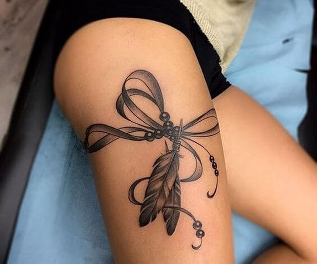 Unique tattoo designs for women's legs, including symbolic and meaningful symbols